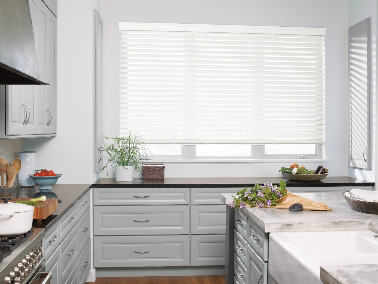 Hunter Douglas EverWood® Faux Wood Blinds hanging in a kitchen window near Laredo, TX